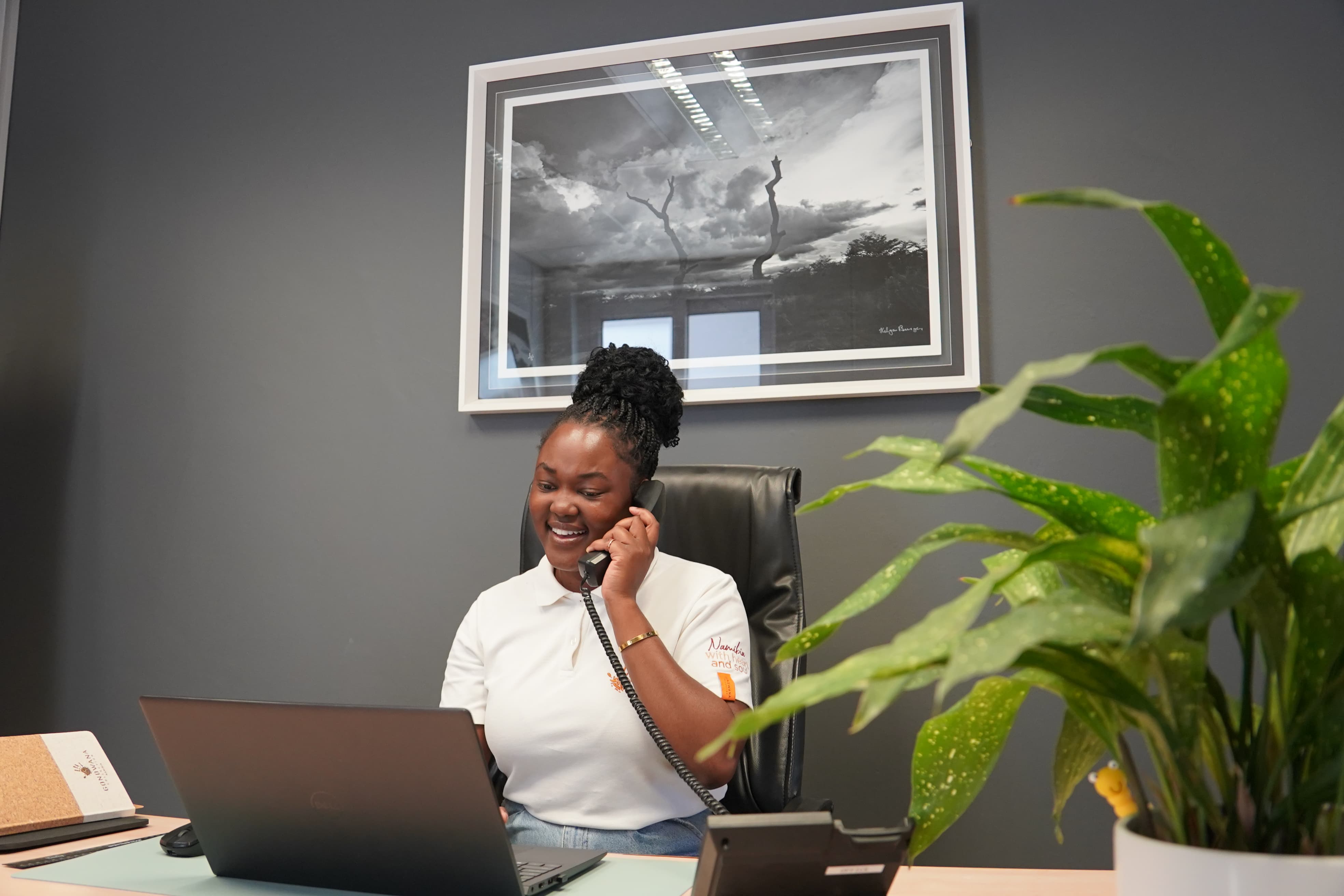 Namibian woman at work, mobile phone, laptop, Namibia