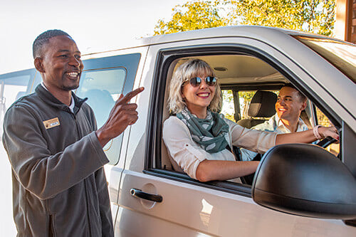 People in a car getting advice, Namibia