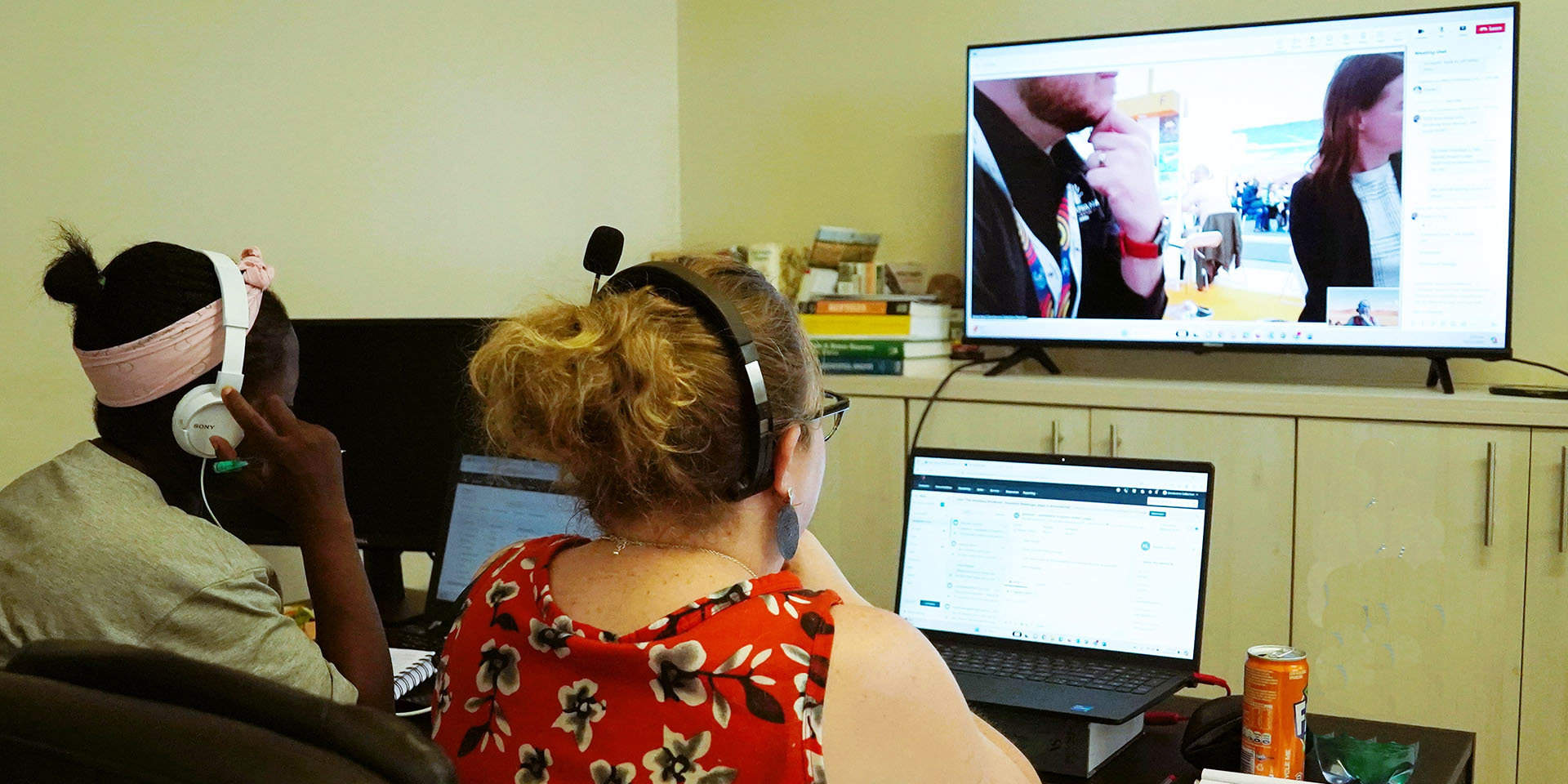2 women in front of a TV screen