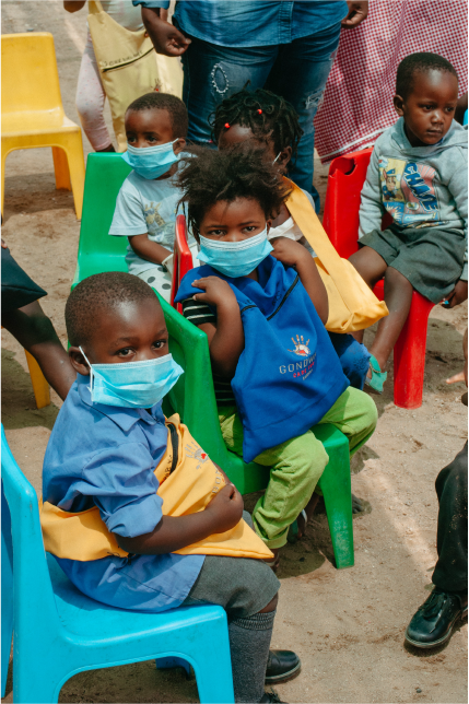 Children receiving Back-to-School Christmas Bags